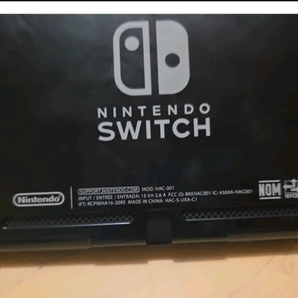 Nintendo Switch with Black Pro Controller and Blue Red Wired Controller